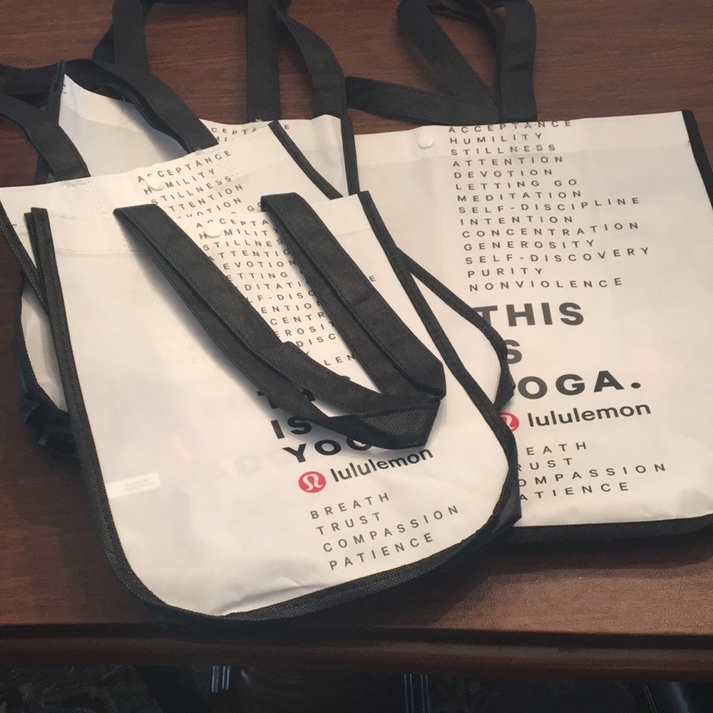 Lululemon white shopping bags.